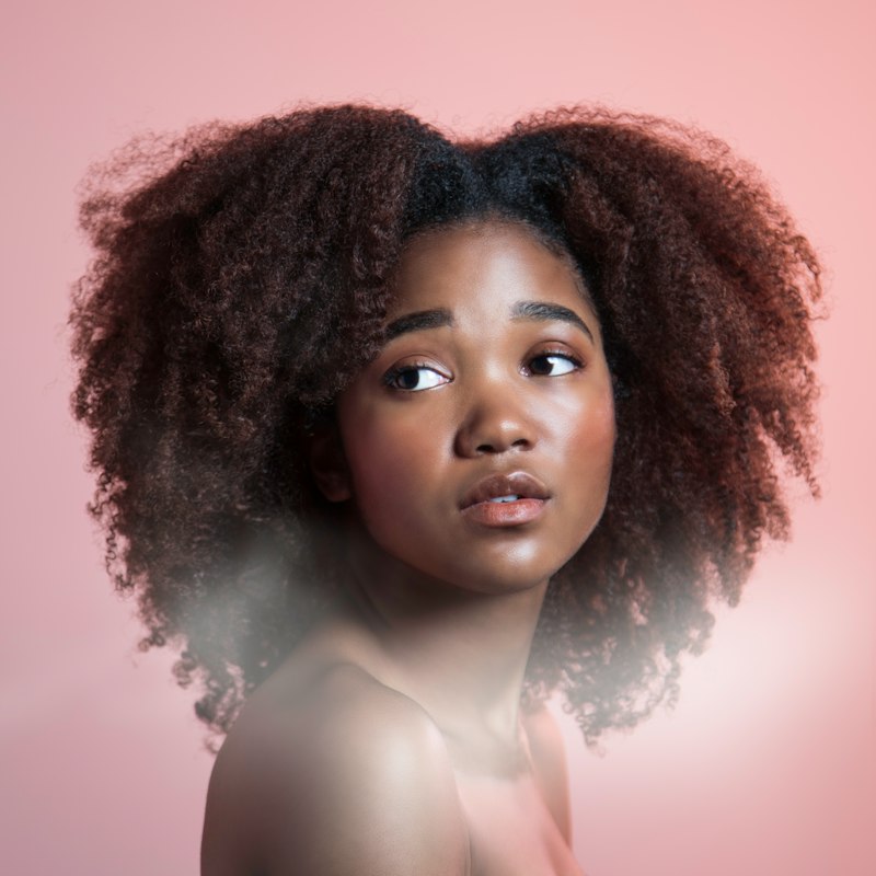 Woman with healthy natural hair - hair care products in Cameroon